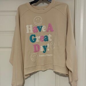 SMILEY WORLD Beige cropped Graphic Sweatshirt.